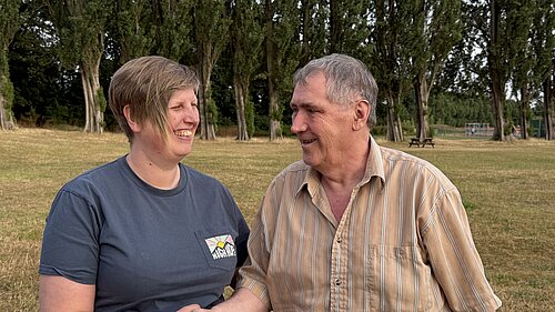 Liz Morgan-Danvers on the left, shaking hands with Gary Long on the right